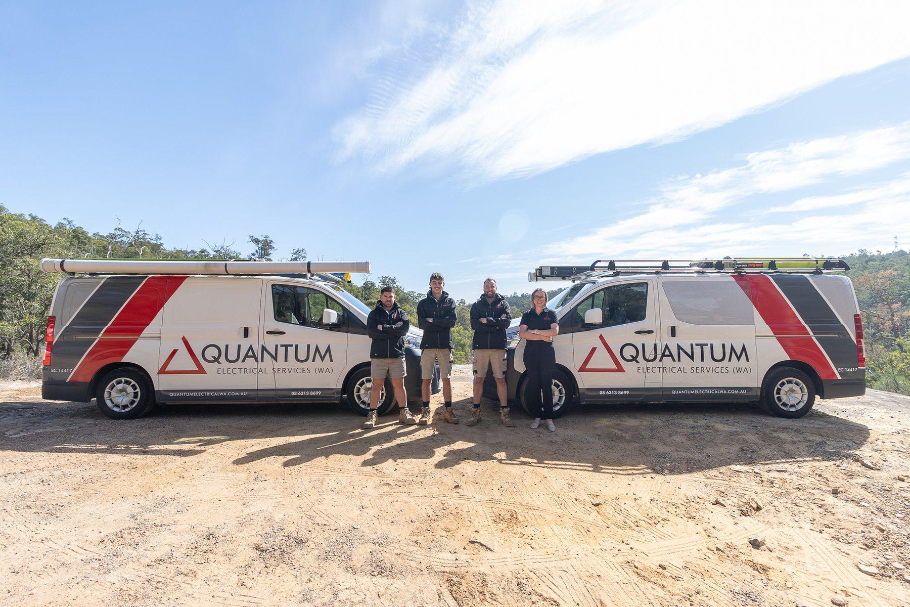 Two Quantum Electrical vans and the team on a bush block in the Perth Hills